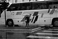 Girl With Umbrella and Bus