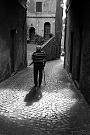 Man Walking Under Arched Passage