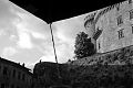 Man Sitting on Castle Wall